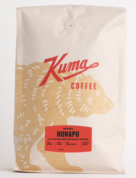 craft bag of bulk 5lb specialty coffee, kuma coffee logo with coffee bear wrapped around the front of the bag, side view of biotre biodegradable Guatemala Hunapu