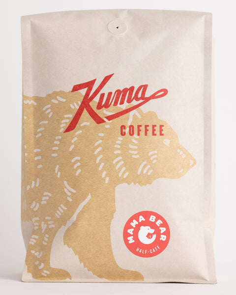 Kuma Coffee Craft coffee bulk bag compostable coffee, Momma bear blend 50/50 decaf, with a coffee bear wrapping around the front and a pink sticker beneath