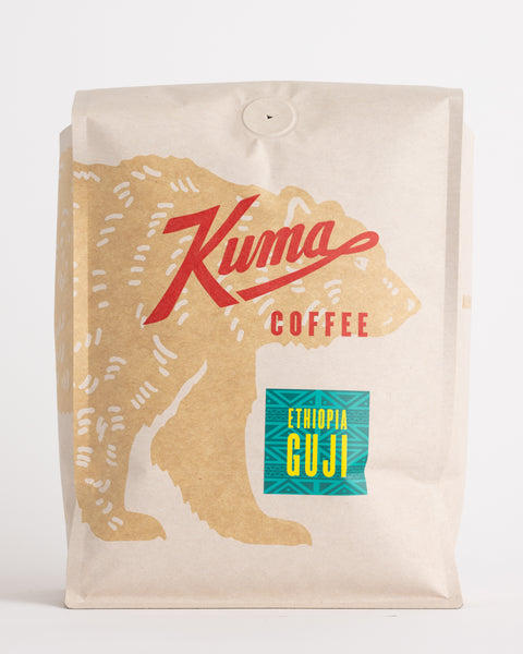 Kuma Coffee Craft bulk coffee bag compostable coffee, Ethiopia Guji on an african coffee sticker, with a coffee bear wrapping around the front