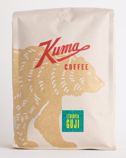Kuma Coffee Craft big bulkcoffee bag compostable coffee, Ethiopia Guji on an african coffee sticker, with a coffee bear wrapping around the front