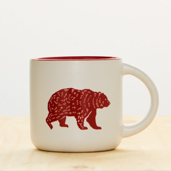 14 oz white stoneware coffee mug with Kuma Coffee bear logo in red